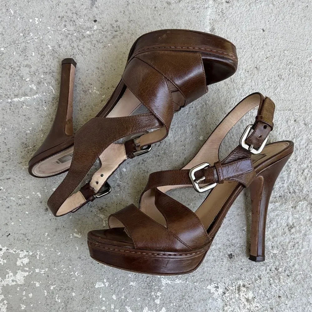 Prada crisscross open toe platforms